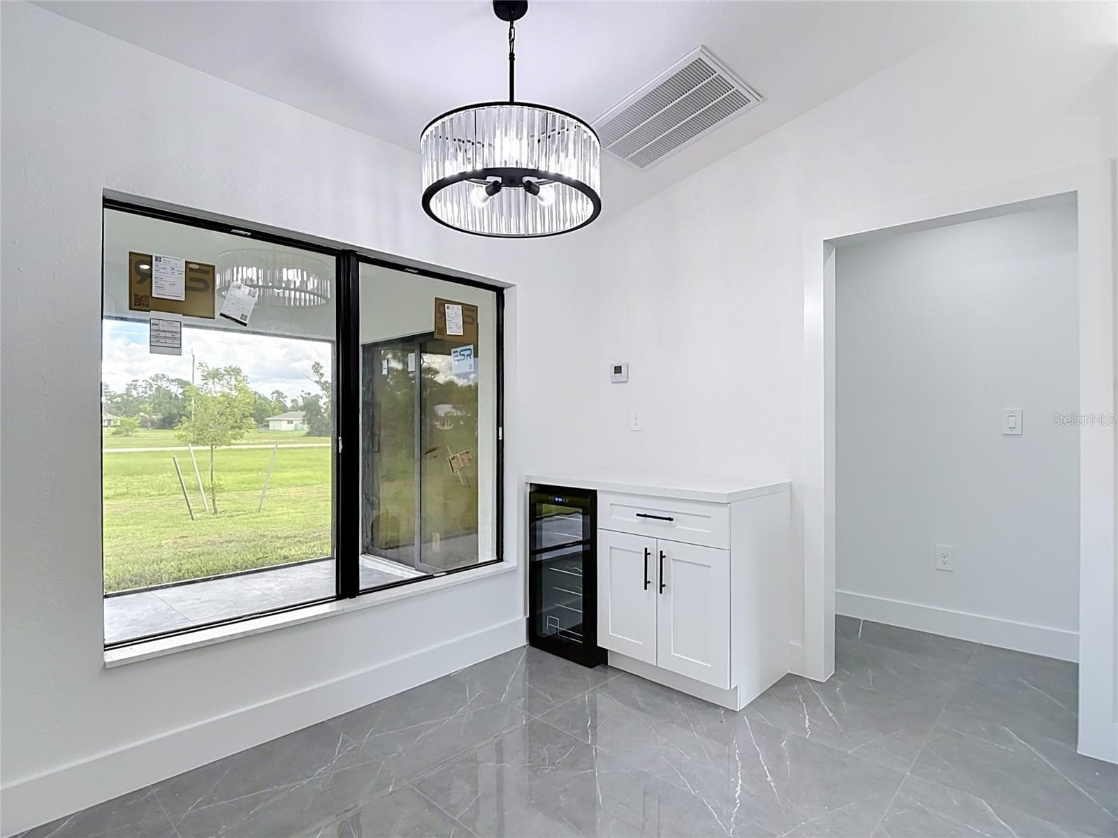 Wine/Coffee bar with wine fridge and what a view out of the extra large windows! - 3613 NW 47TH LN, CAPE CORAL