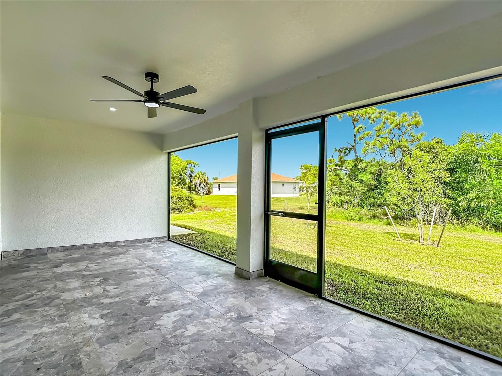 View overlooking backyard - 3613 NW 47TH LN, CAPE CORAL