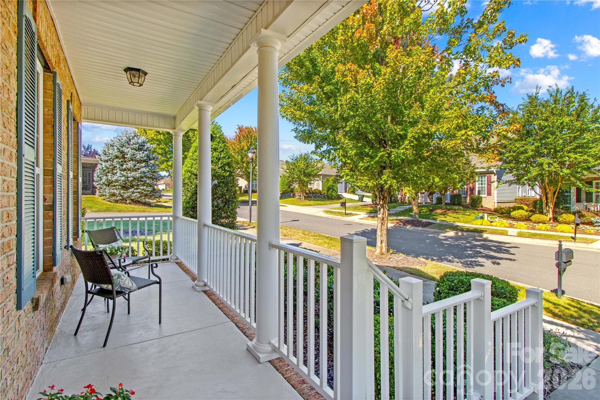 A rocking chair front porch welcomes you into this well-maintained home. - 18114 Ebenezer Drive, Cornelius