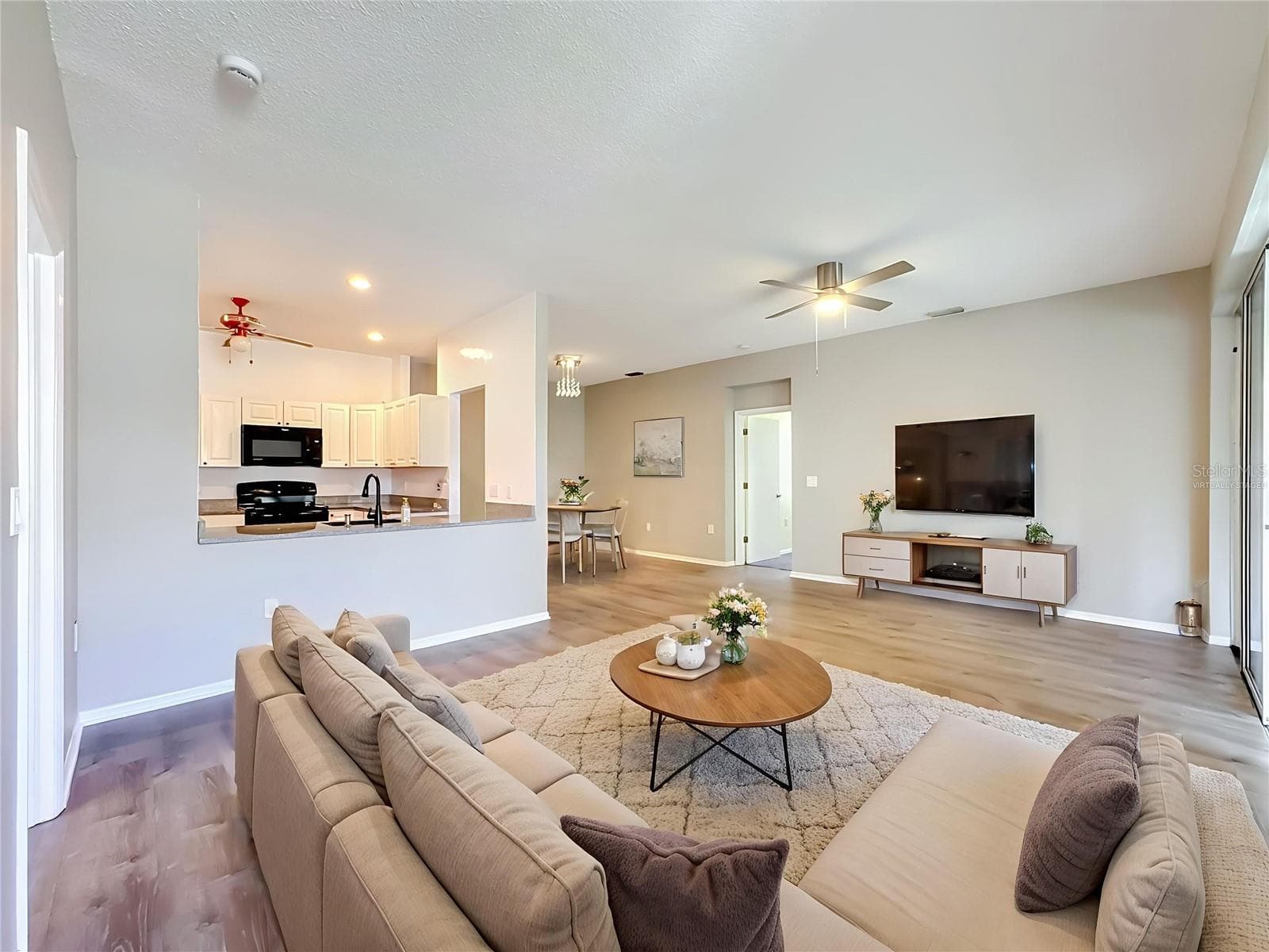 Virtually staged great room. Updated light fixtures in all rooms. - 3308 60TH AVE W, BRADENTON