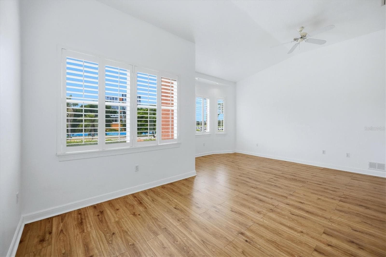large master suite with sitting area in foreground - 5458 46TH CT W, BRADENTON