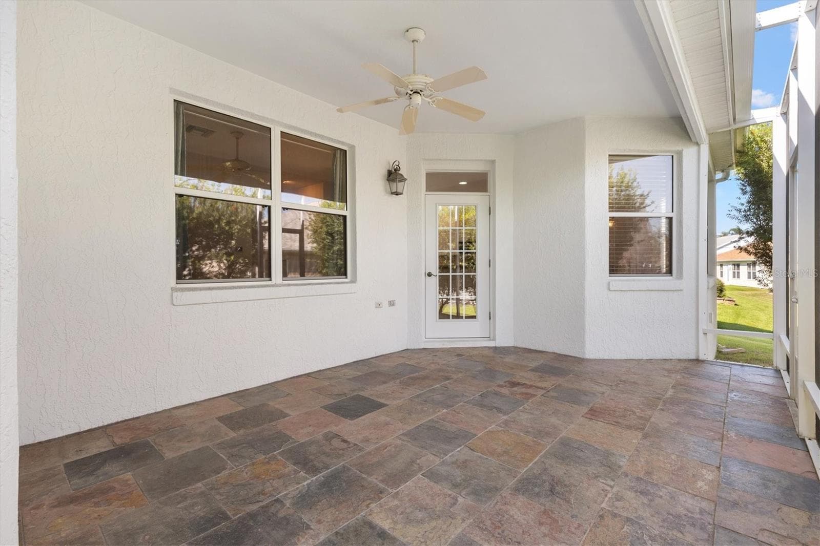 SCREENED LANAI WITH SLATE TILE FLOORING - 1025 WINNSBORO DR, THE VILLAGES