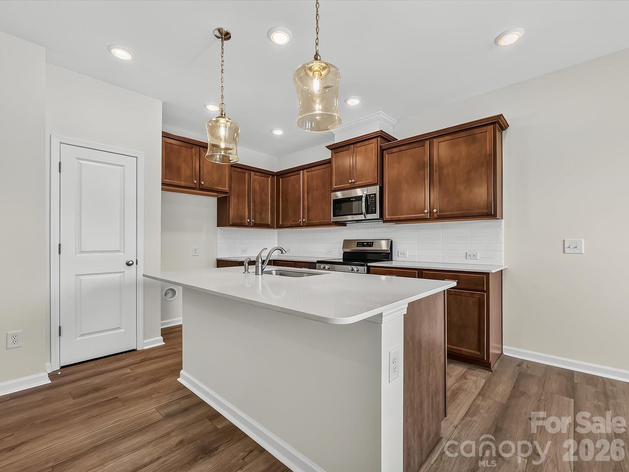 Kitchen with Large Island - 6565 Fire Lily Lane, Charlotte