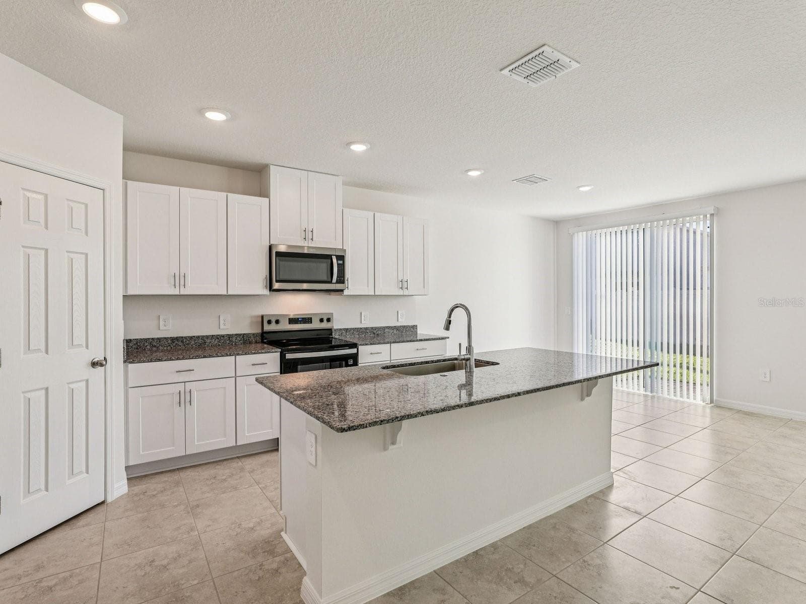 Photo is not of the actual home, but is an inspirational photo of builder’s model home and may depict options, furnishings, and/or decorator features that are not included - 12580 HOMELAND DR, DADE CITY