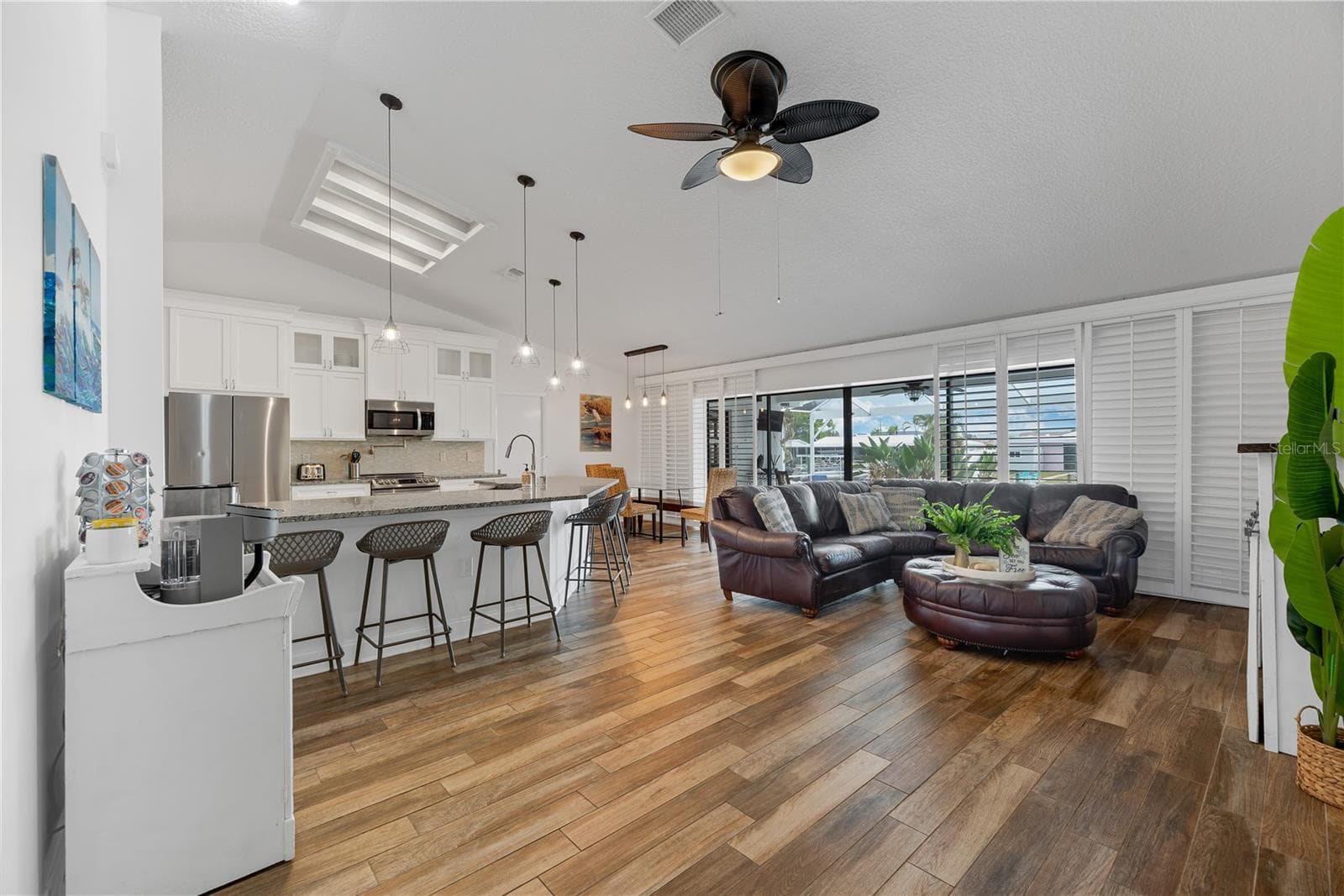 Open-concept floor plan where 12-foot sliding glass doors open to the expansive outdoor living area and beautiful waterfront views. - 743 KINGSTON CT, APOLLO BEACH