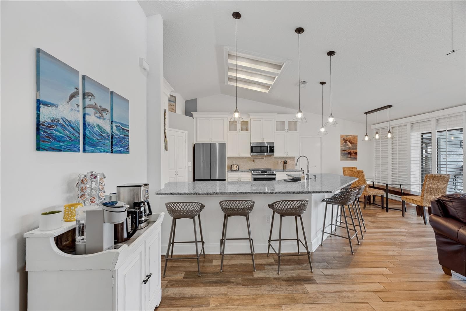 Cathedral ceilings and wood-plank-look tile flooring provide a stylish, durable finish throughout the entire home with no carpet. - 743 KINGSTON CT, APOLLO BEACH