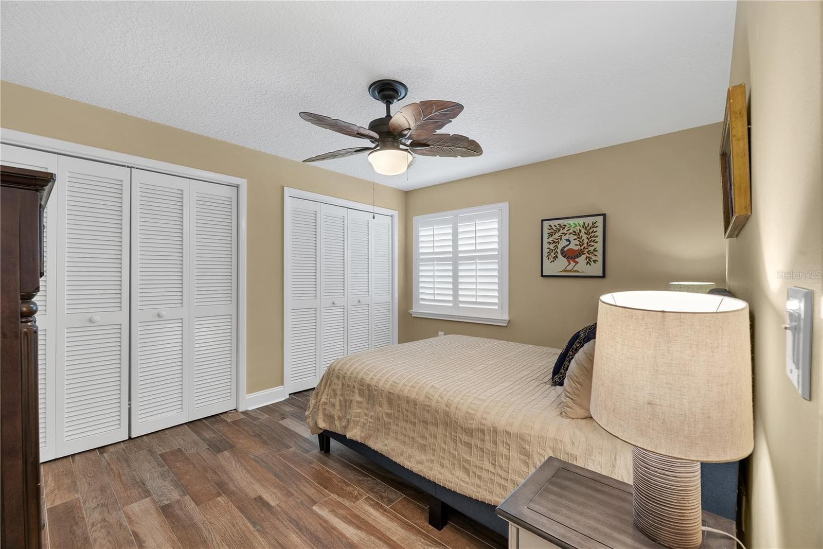 Bedroom # 3 has two built-in closets, wood-plank-look tile flooring and plantation shutters and share a hall guest bathroom. - 743 KINGSTON CT, APOLLO BEACH
