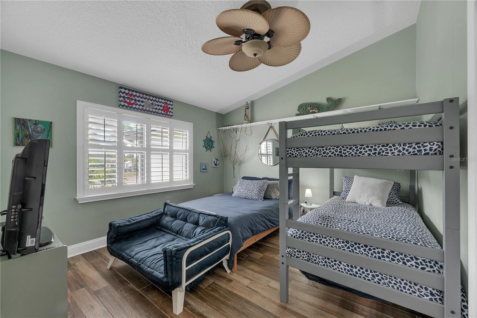 Bedroom #4 on the front of this home is set up as a bunk room and has cathedral ceiling and lots of natural light pouring in. - 743 KINGSTON CT, APOLLO BEACH