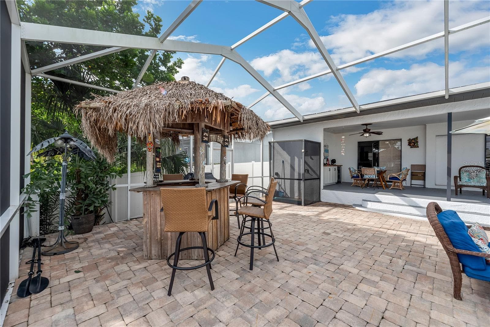 Next to the Tiki bar is the first of two outside showers. - 743 KINGSTON CT, APOLLO BEACH