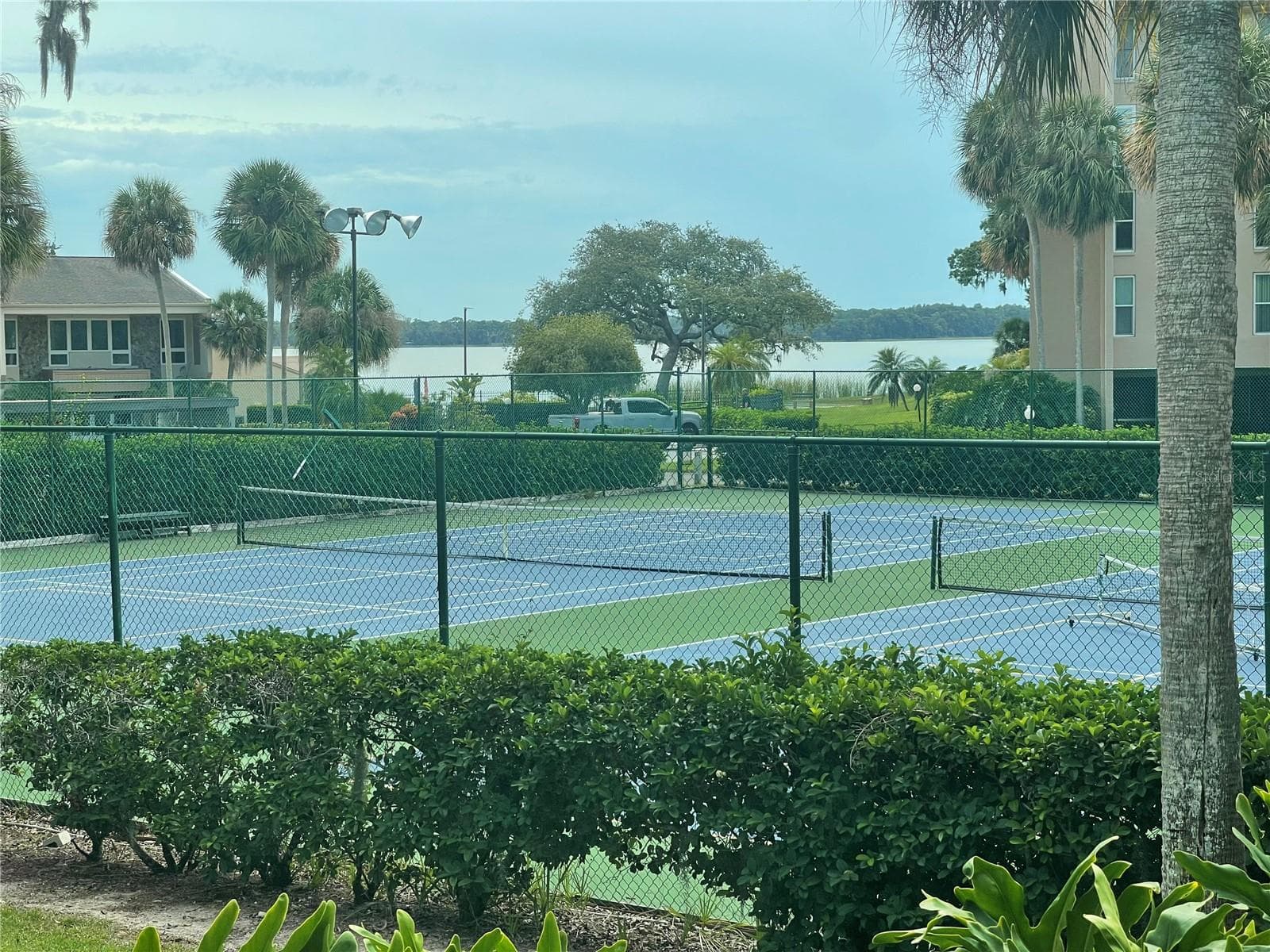water view and tennis court view from your private deck - 90 S HIGHLAND AVE #1, TARPON SPRINGS
