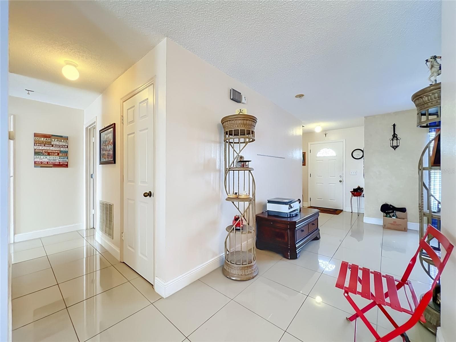 And off to the right is the entrance to the 1st floor Primary bedroom - 12900 LOS ALAMITOS CT, ORLANDO