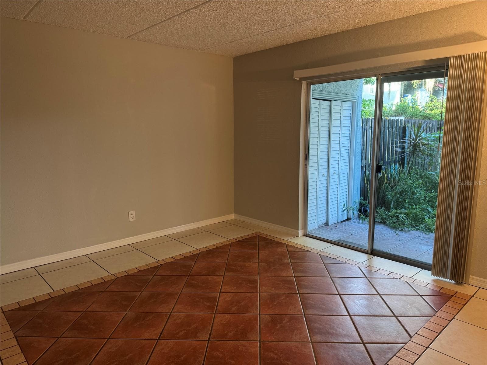 ZOOMED IN FROM INTERIOR STAIRS TO 1ST FLOOR REAR PATIO & LAUNDRY CLOSET - 2884 SOMERSET PARK DR #2907, TAMPA