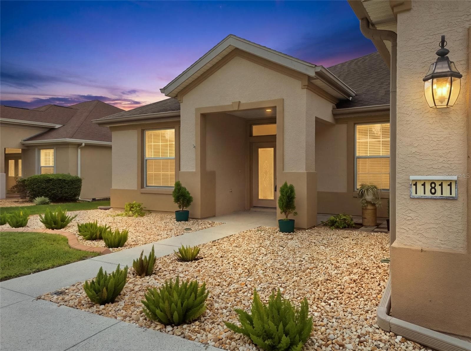 Entry side view twilight - 11811 SE 91ST CIR, SUMMERFIELD