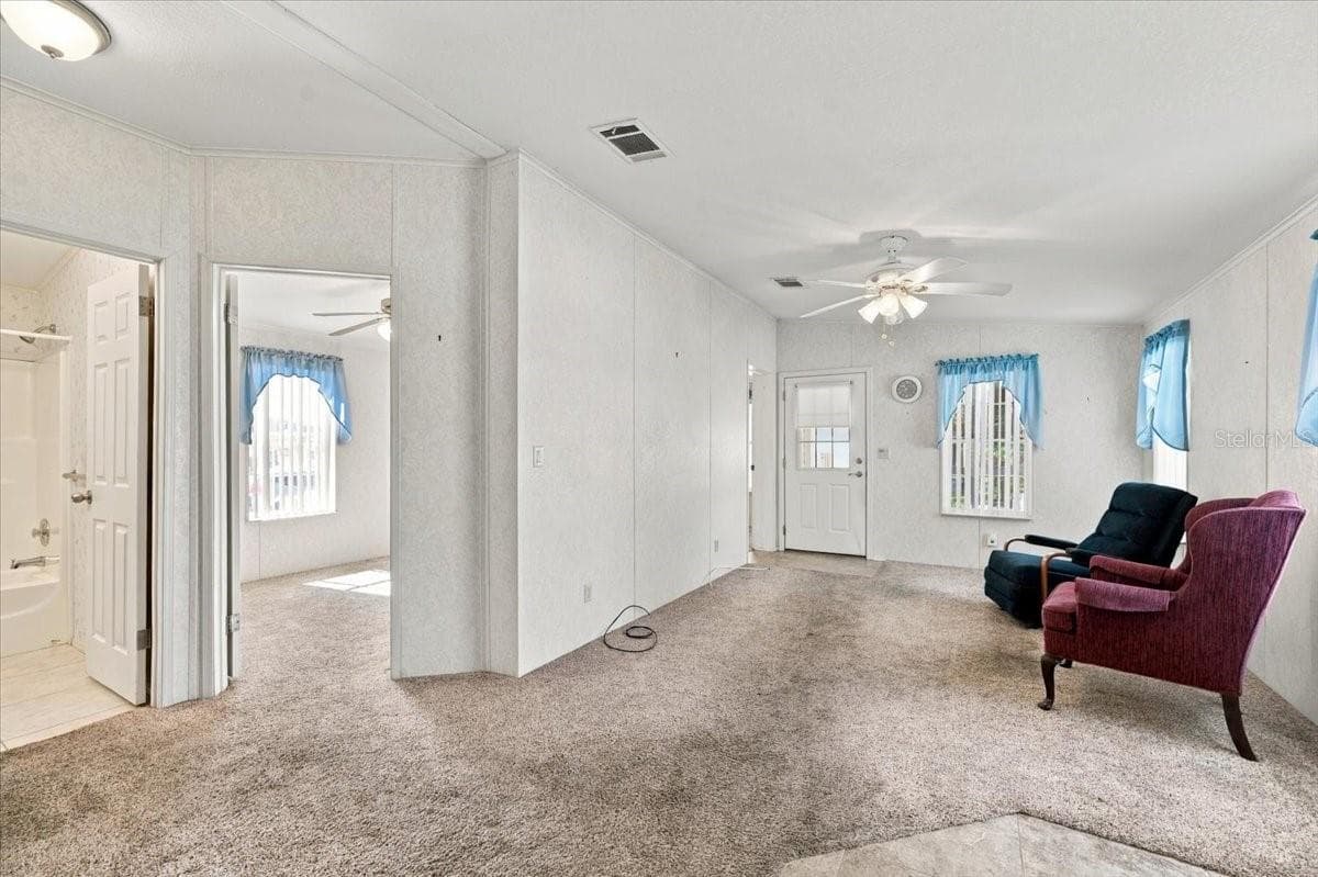 Living Room looking towards the 3rd bedroom - 59 BEAVERKILL DR, LAKE WALES