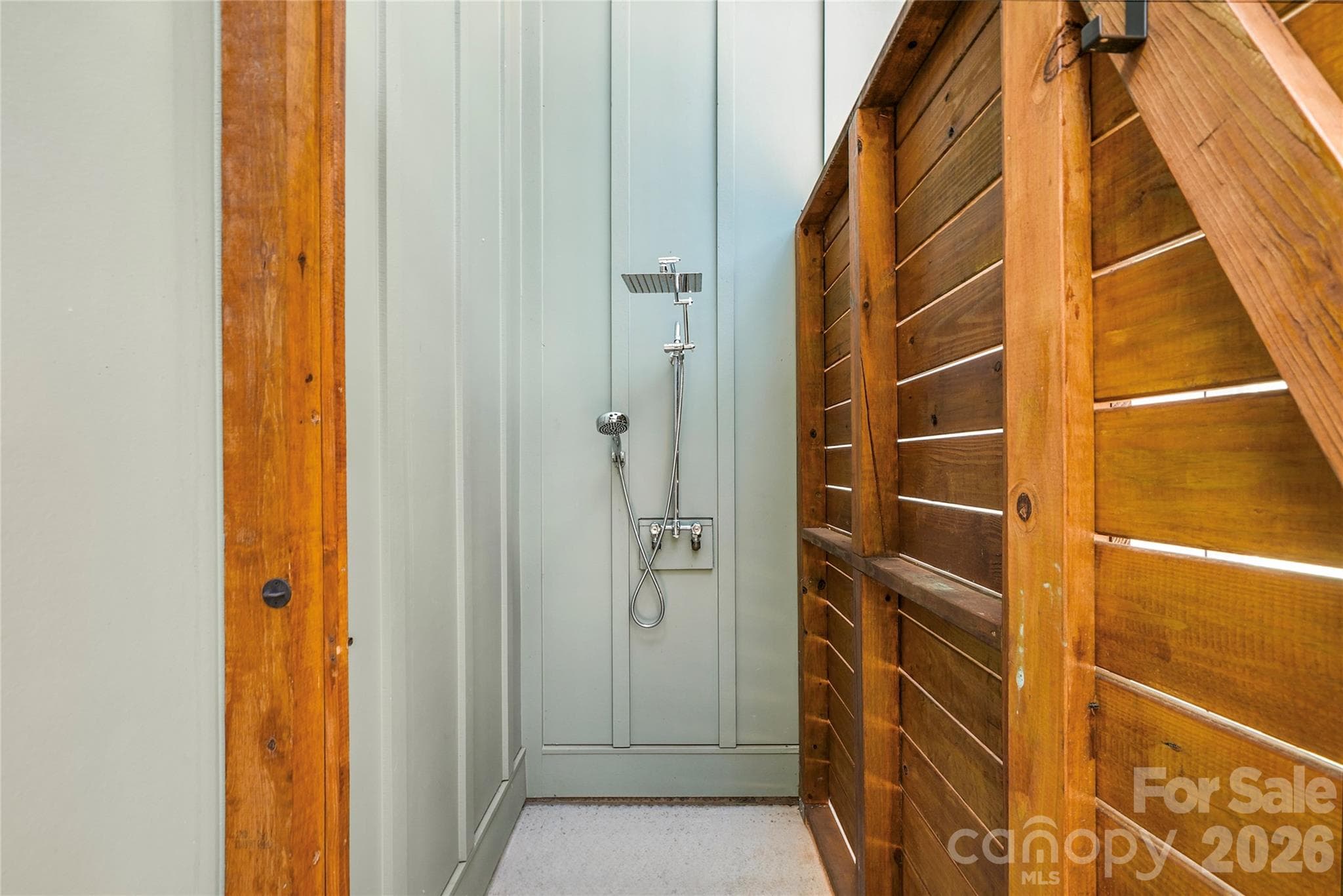 Outdoor shower offers a convenient place to rinse off after enjoying the pool or a day on the lake. - 143 Hideaway Lane, Mooresville