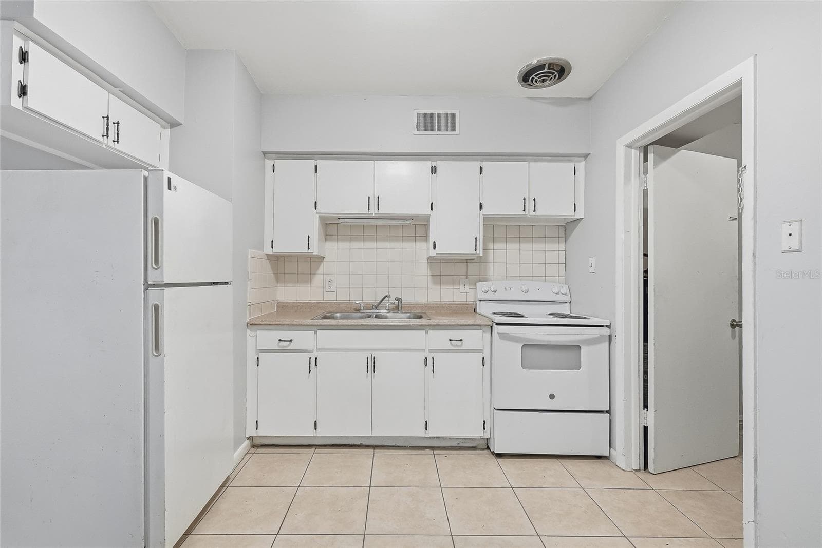 Duplex at 1408 E 140TH AVE, TAMPA, photo 15 of 55