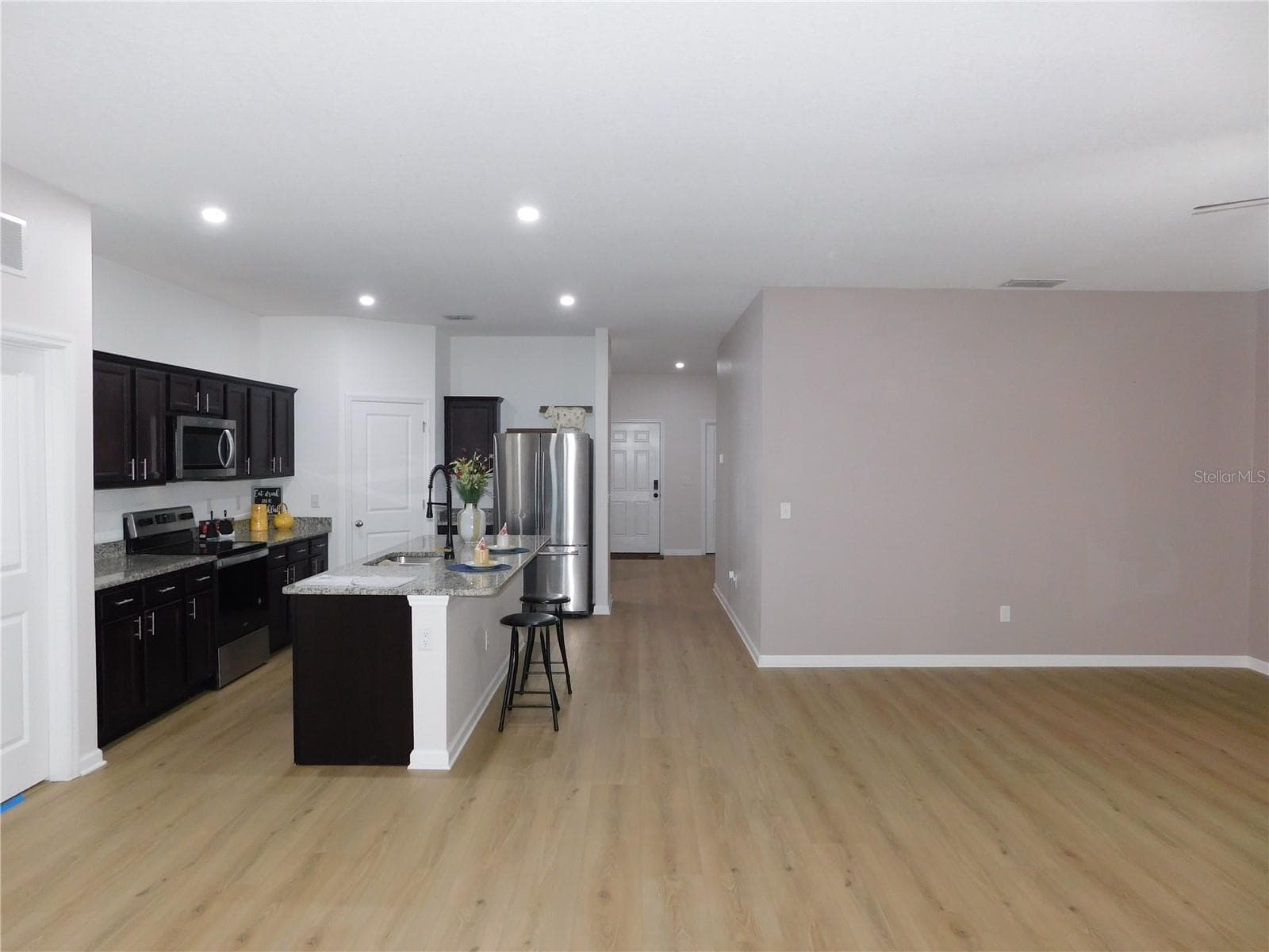 Designer LVP 9X60 throughout living areas ready to greet you! - 1261 ANCHOR BEND DR, RUSKIN