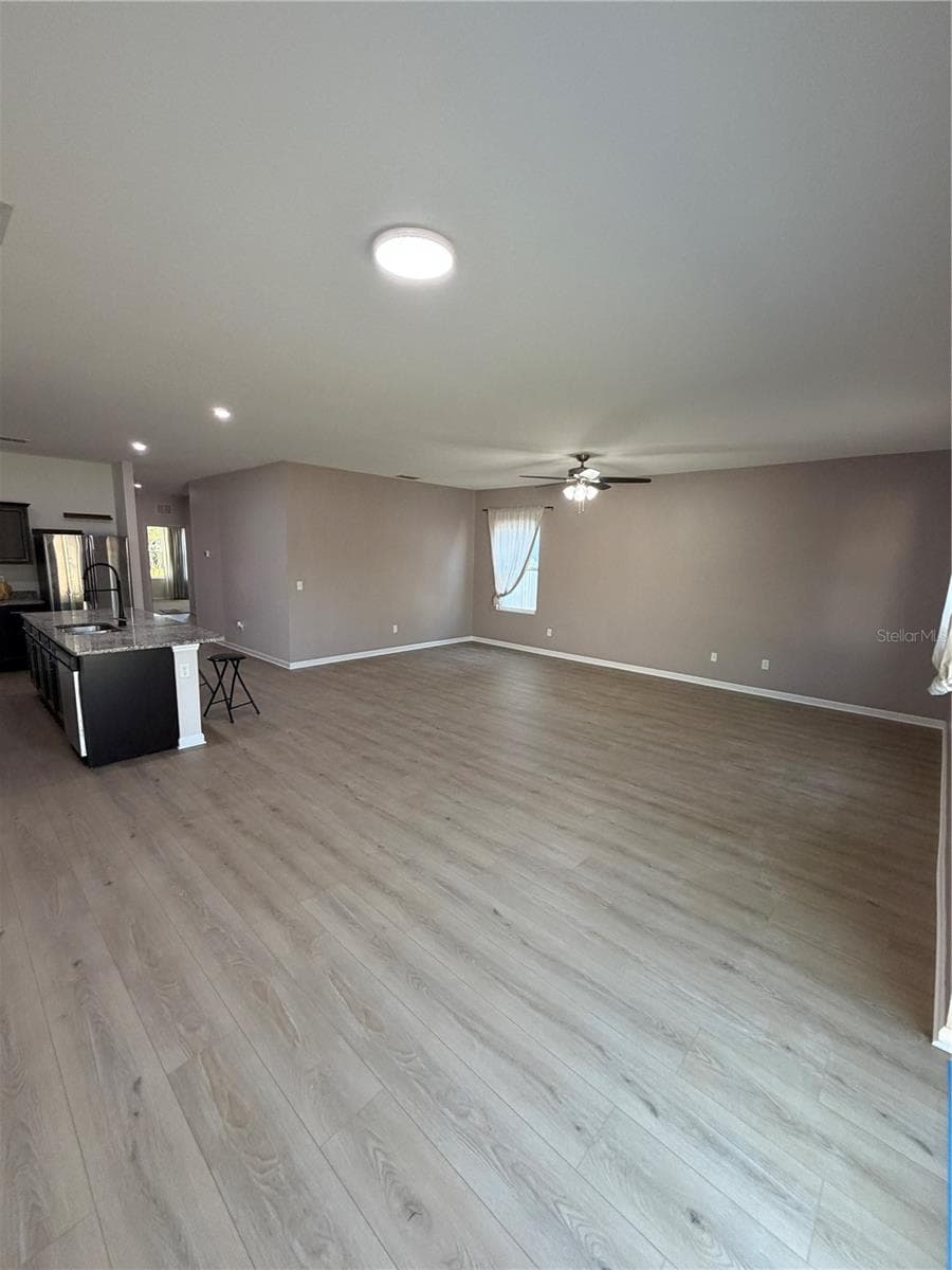 Designer LVP 9X60 throughout living areas ready to greet you! Expansive Living and Dining Areas open concept - 1261 ANCHOR BEND DR, RUSKIN