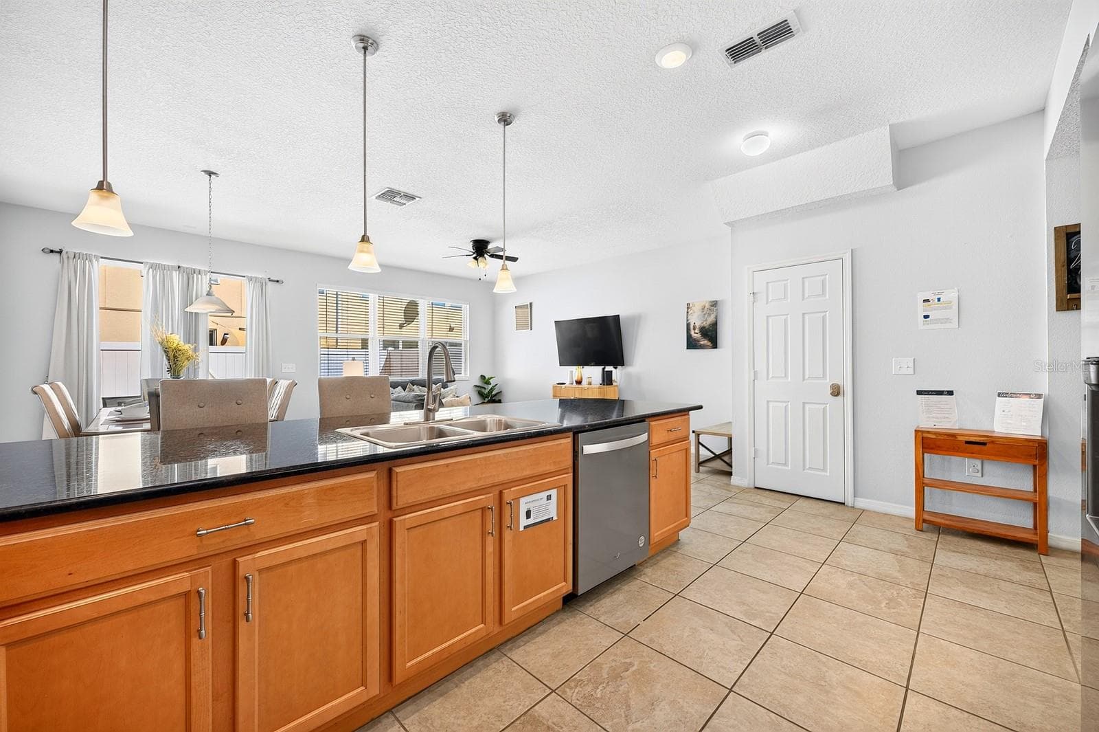 Long breakfast bar for casual dining. - 5109 KILLARNEY WAY, KISSIMMEE