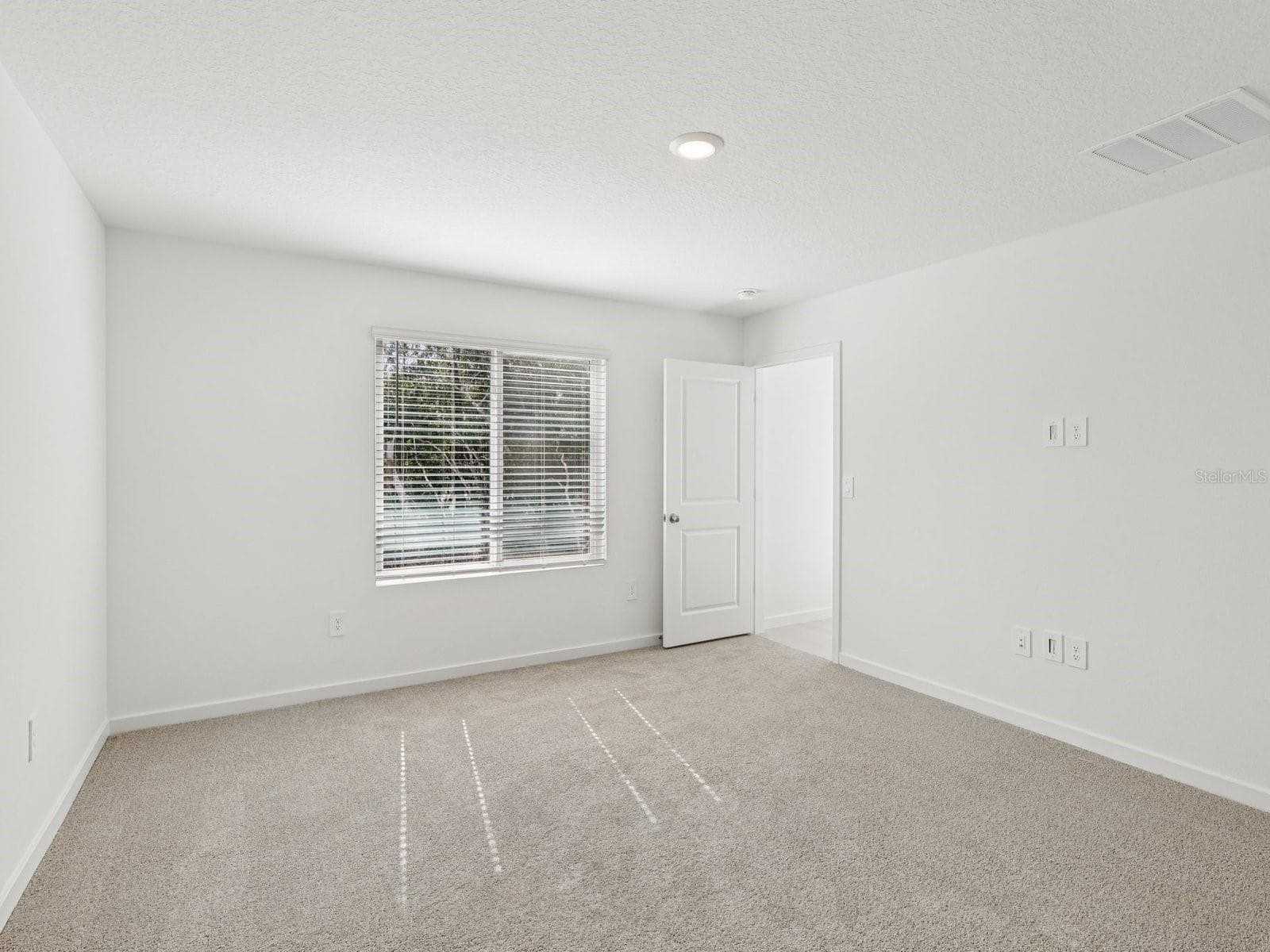 Photo is not of the actual home, but is an inspirational photo of builder’s model home and may depict options, furnishings, and/or decorator features that are not included - 124 WANDERING CREEK WAY, PALM COAST