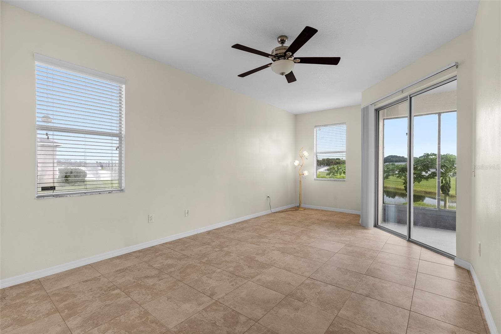 Spacious Primary Bedroom Has A Sliding Doors In Patio - 3652 MADBURY CIR, LAKELAND