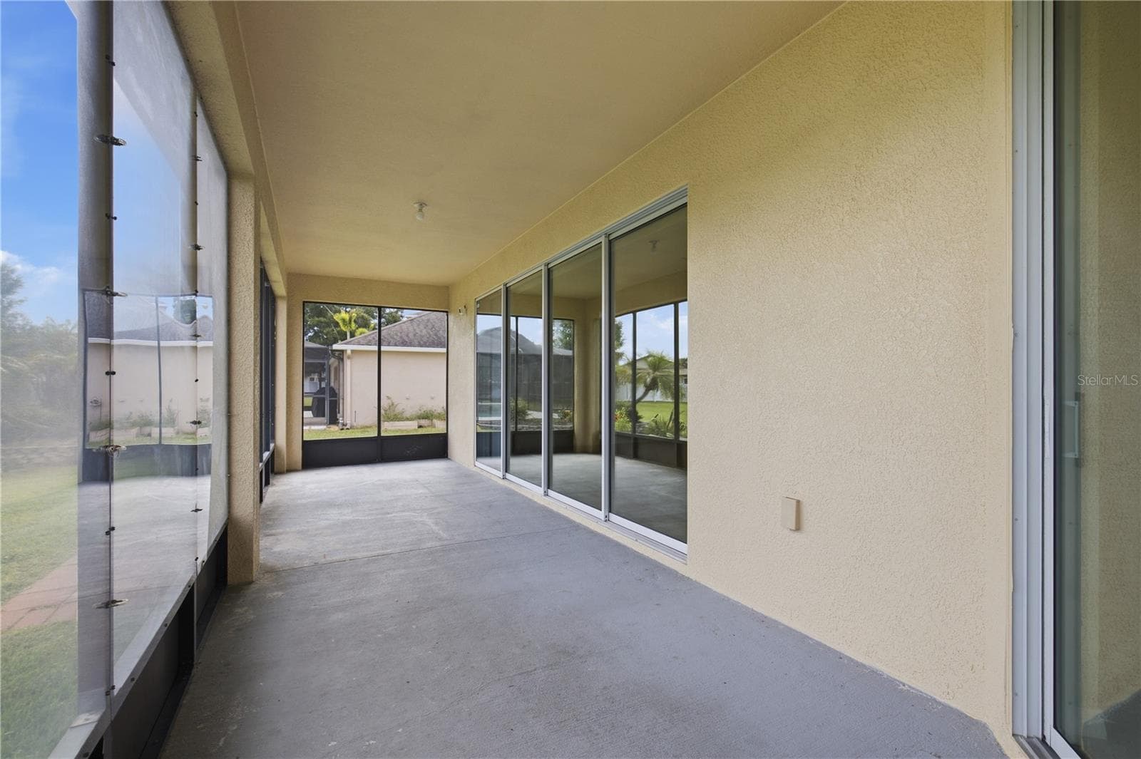Enclosed Backyard Patio - View From Primary Bedroom - 3652 MADBURY CIR, LAKELAND