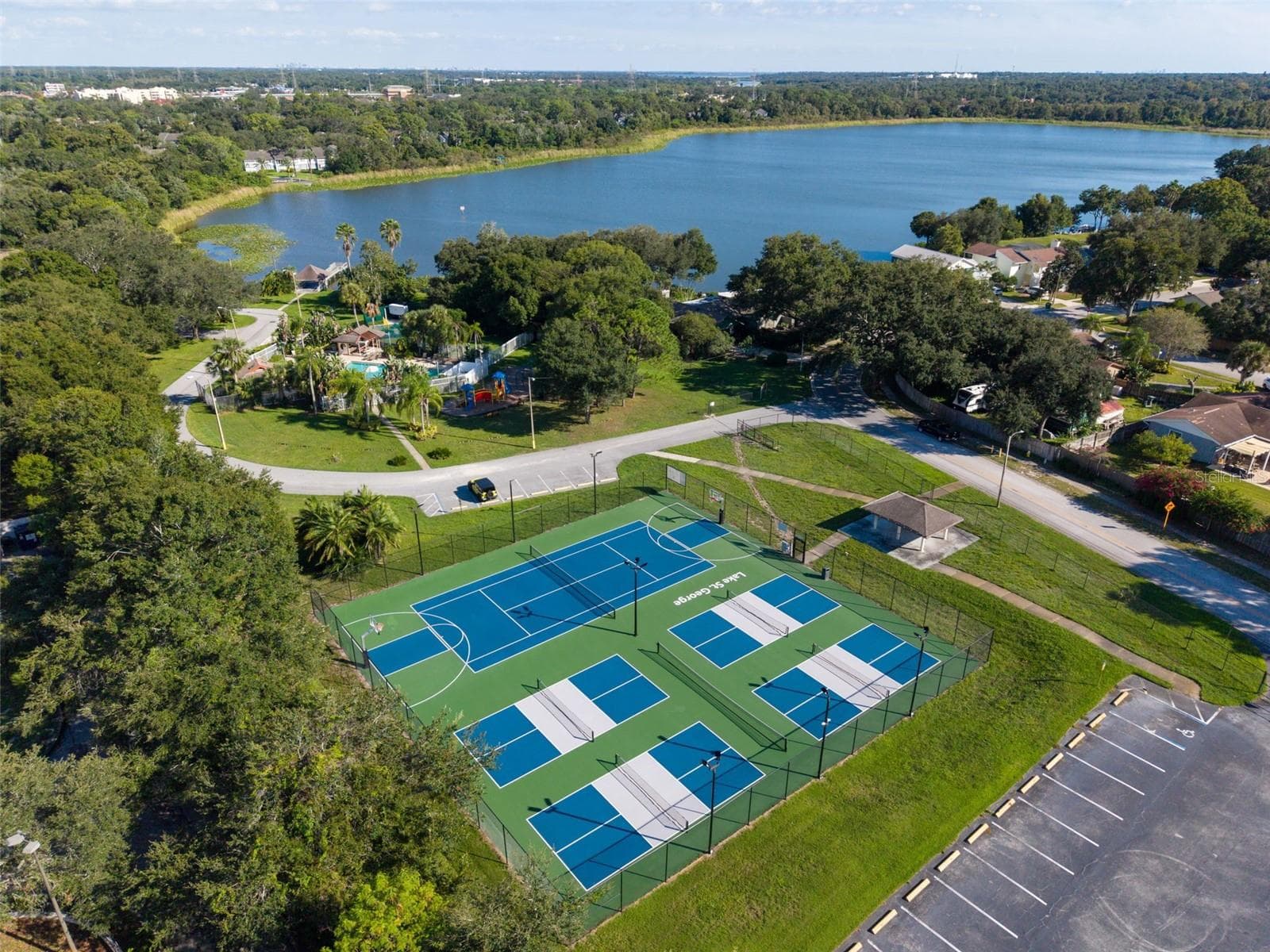 Lake St George Community swimming pool, tennis courts, basketball courts, playground, water access and dock. - 3992 ORCHARD HILL CIR, PALM HARBOR