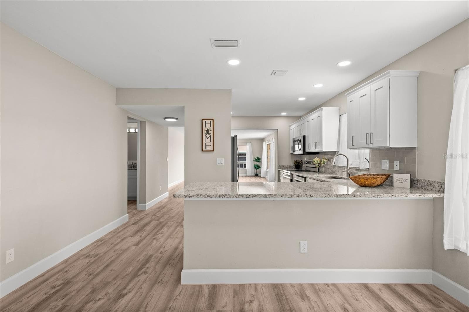 Kitchen with breakfast bar - 1345 SE 40TH TER #2E, CAPE CORAL