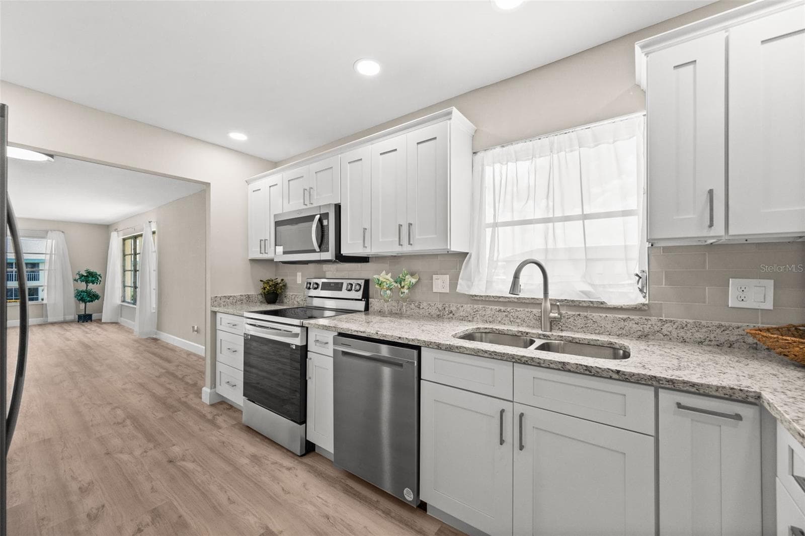 Open kitchen with lots of cabinets - 1345 SE 40TH TER #2E, CAPE CORAL