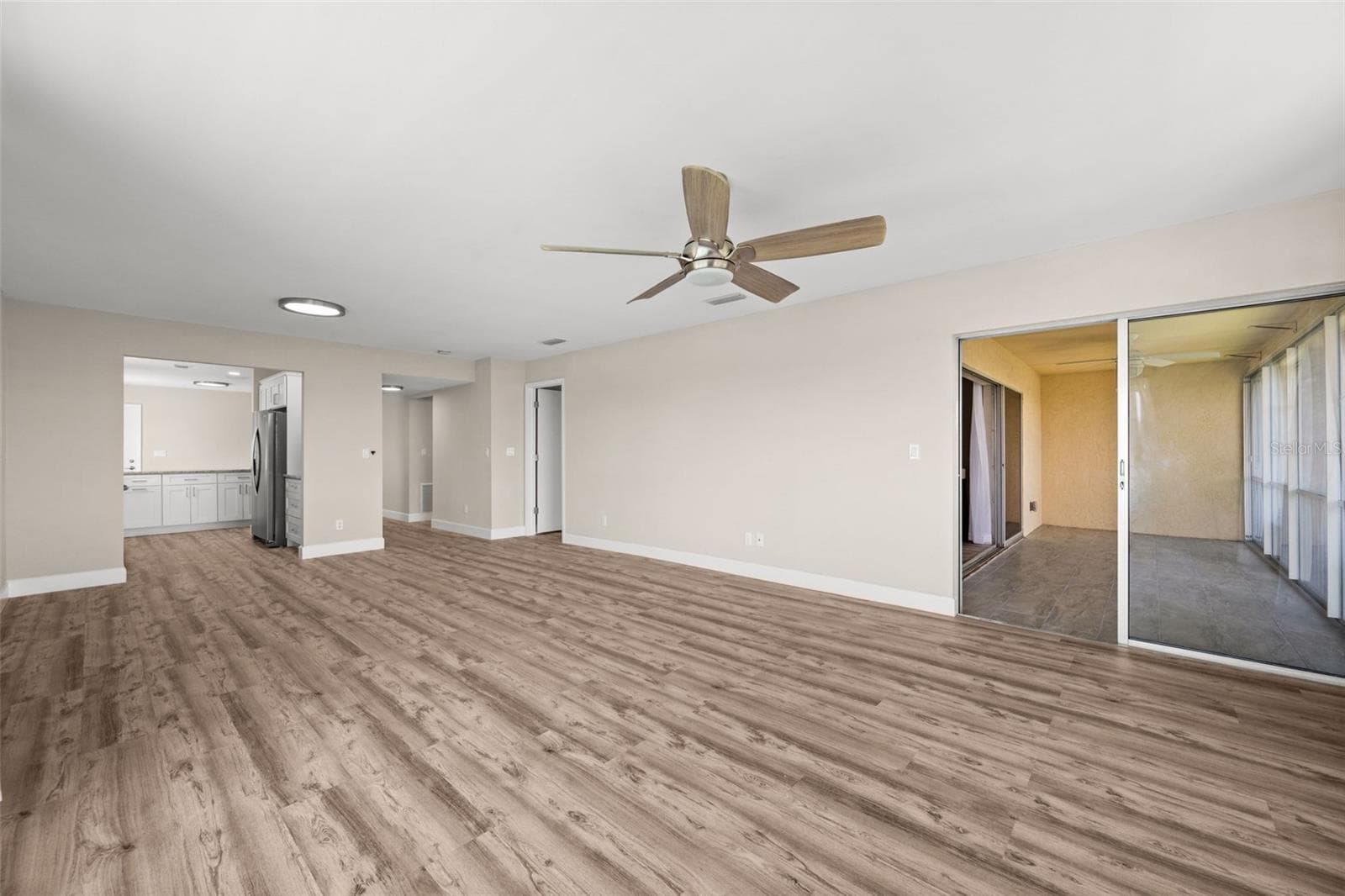 Lanai access from the living room - 1345 SE 40TH TER #2E, CAPE CORAL