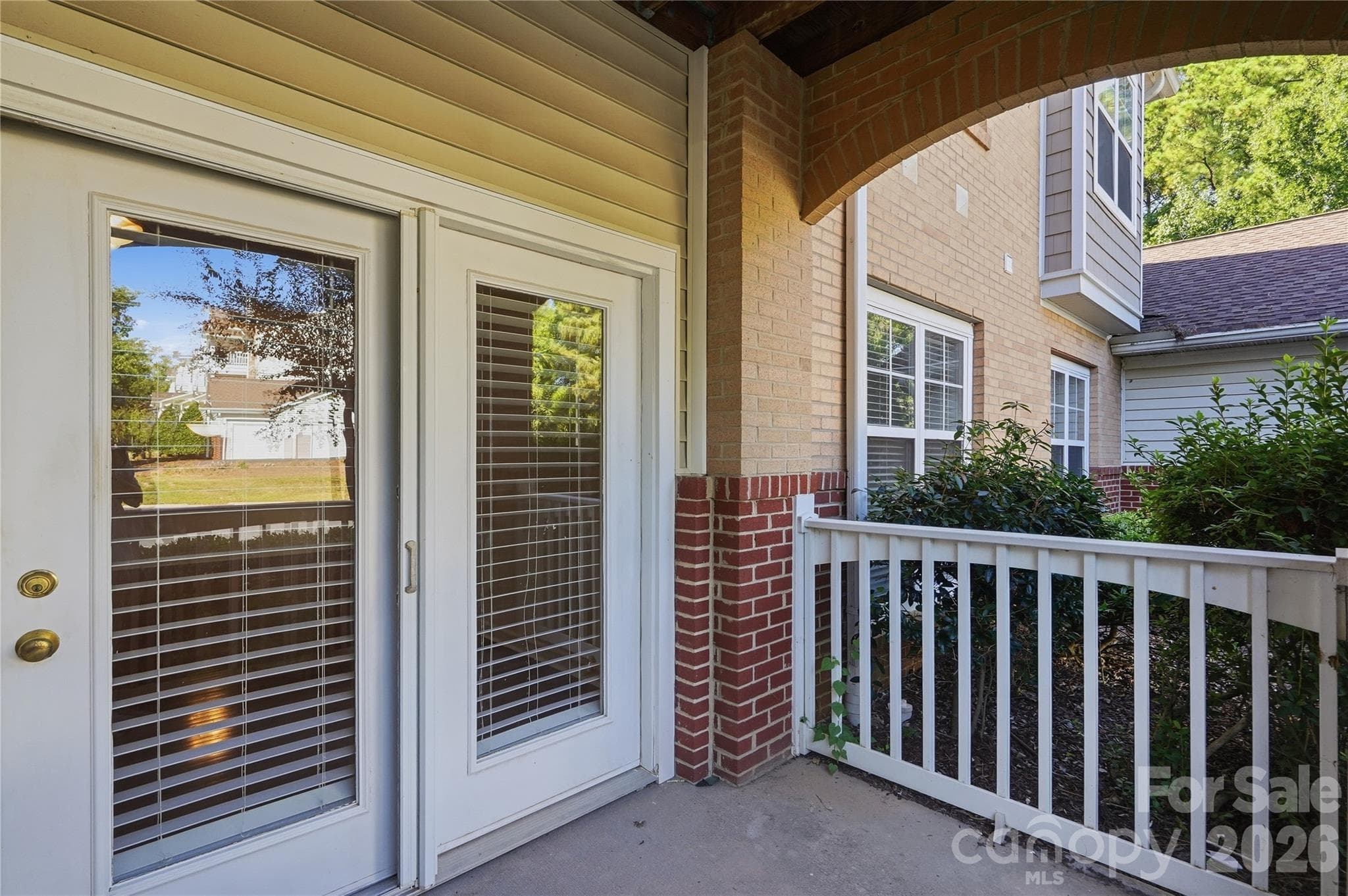 covered porch with storage room - 16406 Redstone Mountain Lane, Charlotte