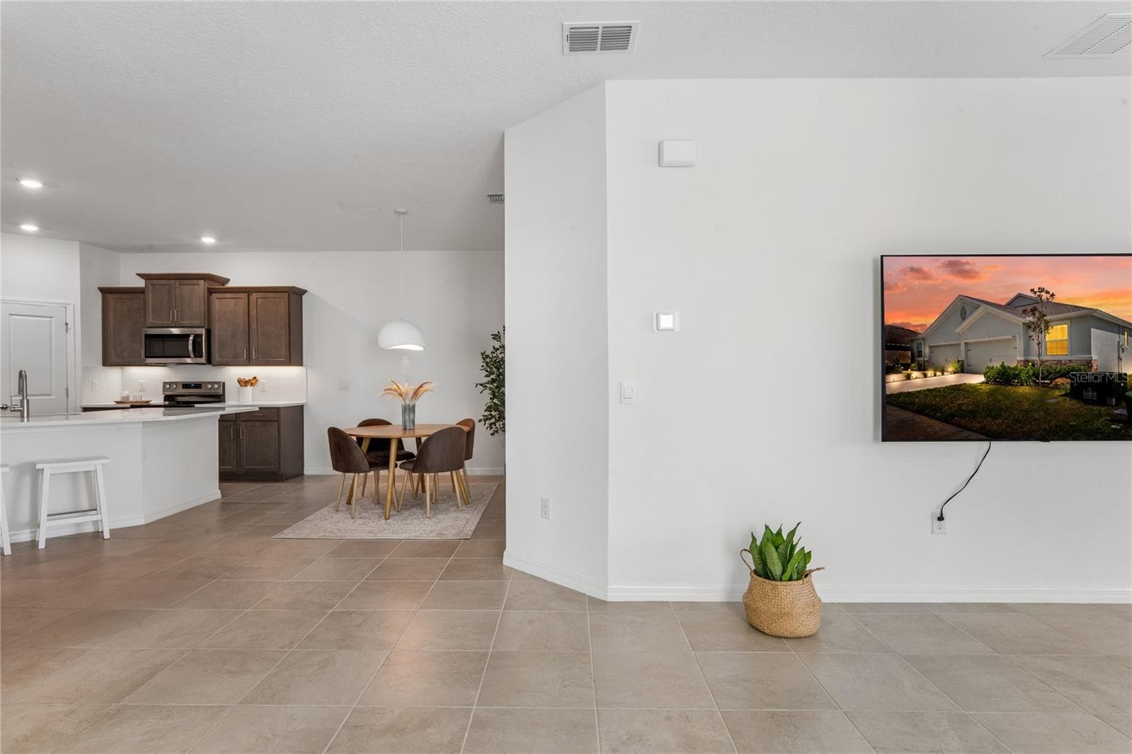 Open floor plan Living/Kitchen/Dining Room space - 8580 BOLD CYPRESS LN, WESLEY CHAPEL