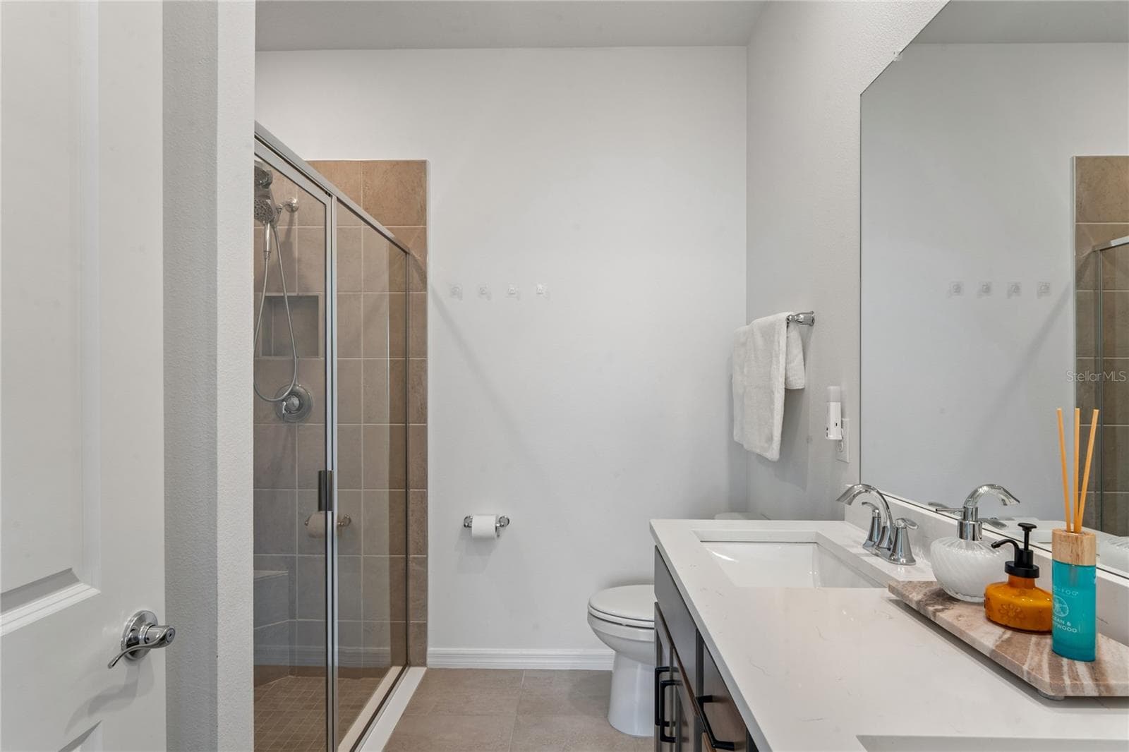 Linen closet in Primary bath - 8580 BOLD CYPRESS LN, WESLEY CHAPEL