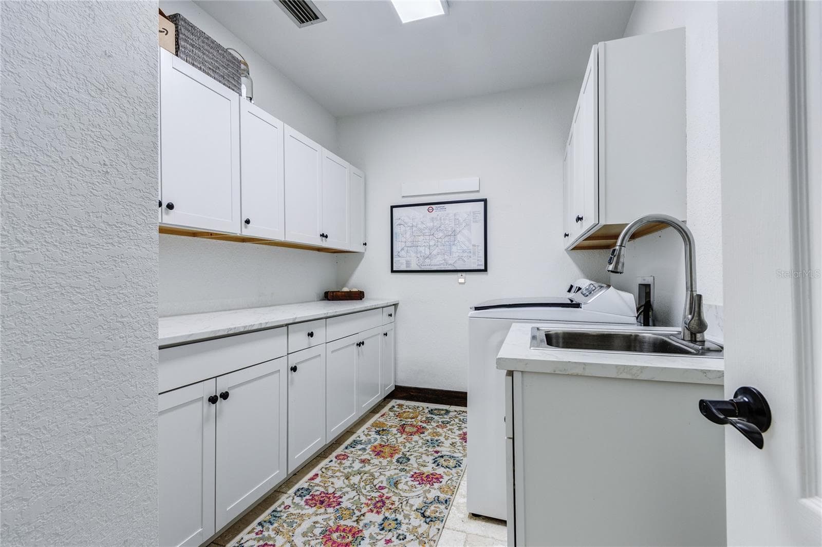 Cabinets galore in laundry room and utility sink! - 32305 PASCO RD, SAN ANTONIO