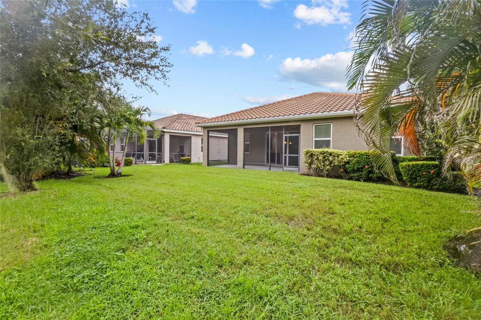 This is the view looking back at the home. Lots of grass and room to run and play! - 2924 ORIOLE DR, SARASOTA