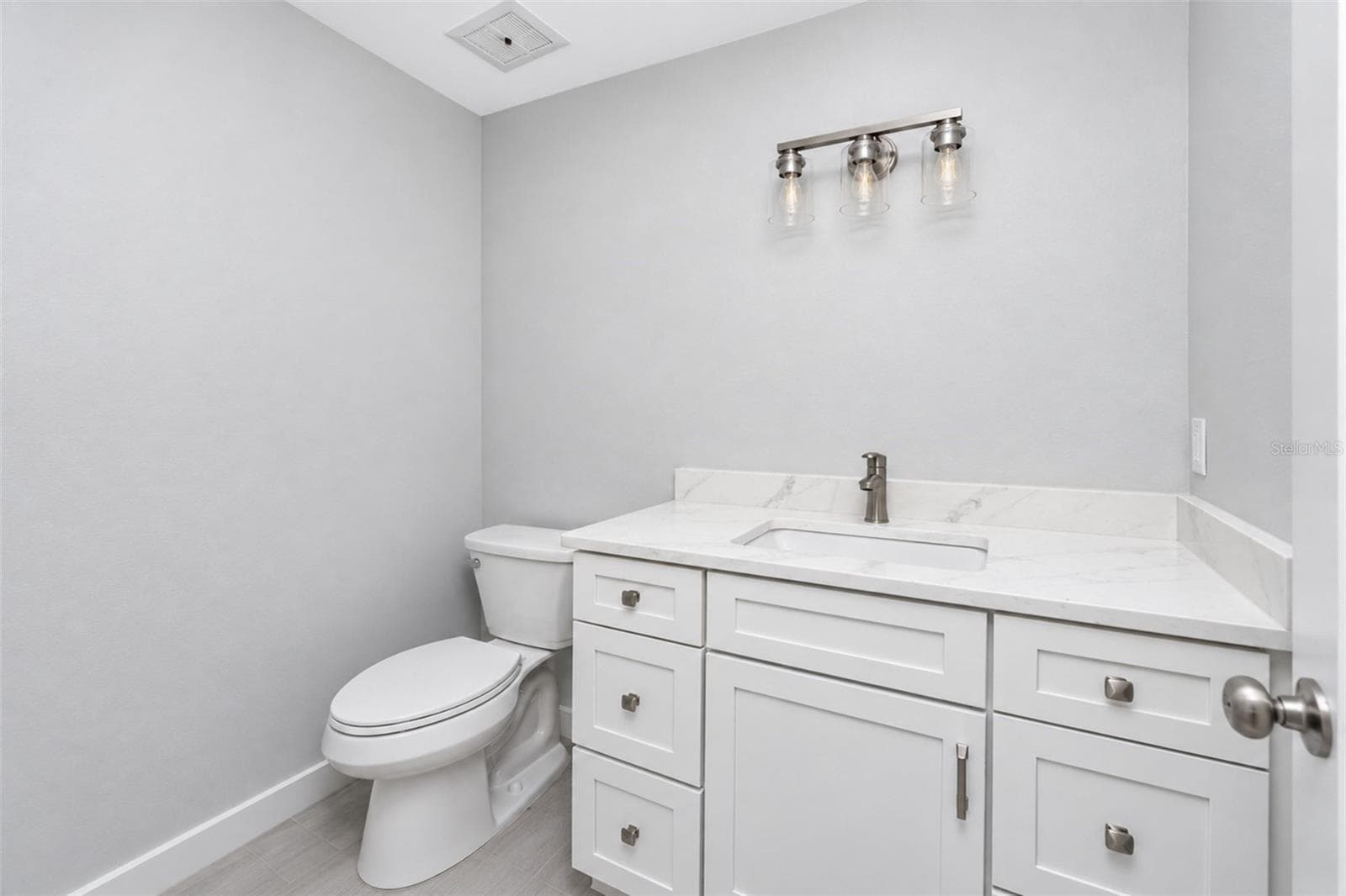Guest Bath with new mission style cabinetry and quartz counters. - 206 BRIGANTINE WAY #206, NOKOMIS