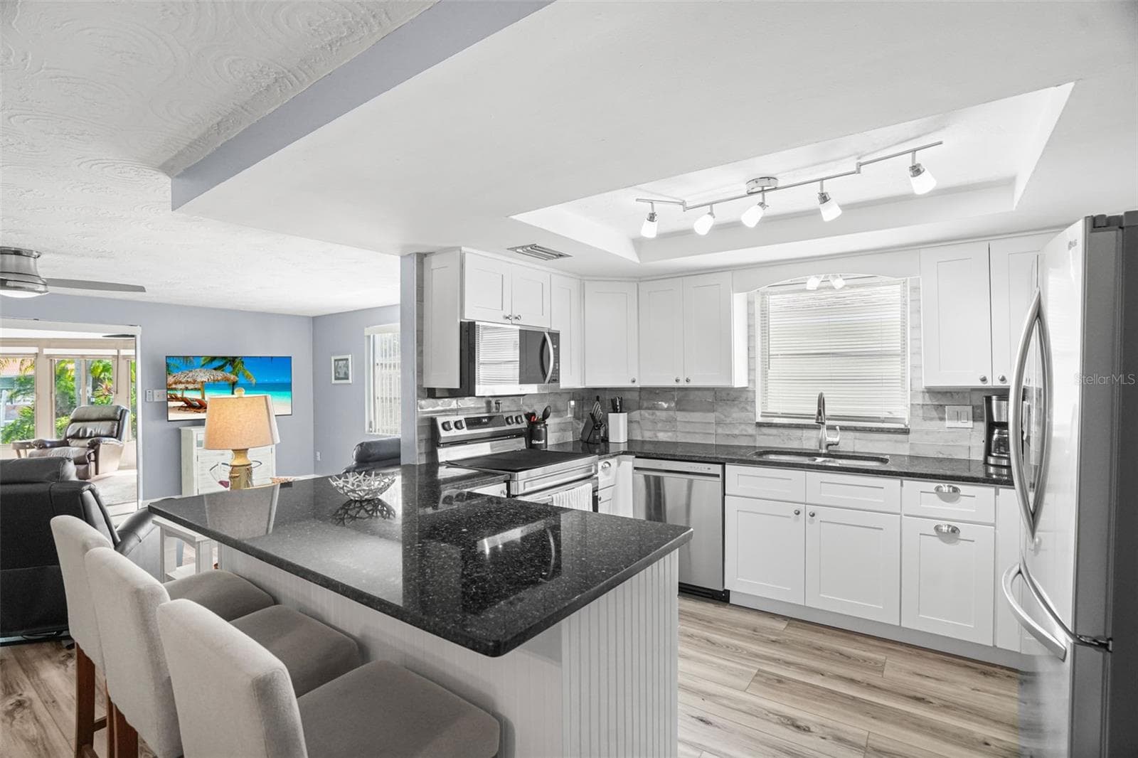 Kitchen with breakfast bar - 4916 POMPANO DR, NEW PORT RICHEY