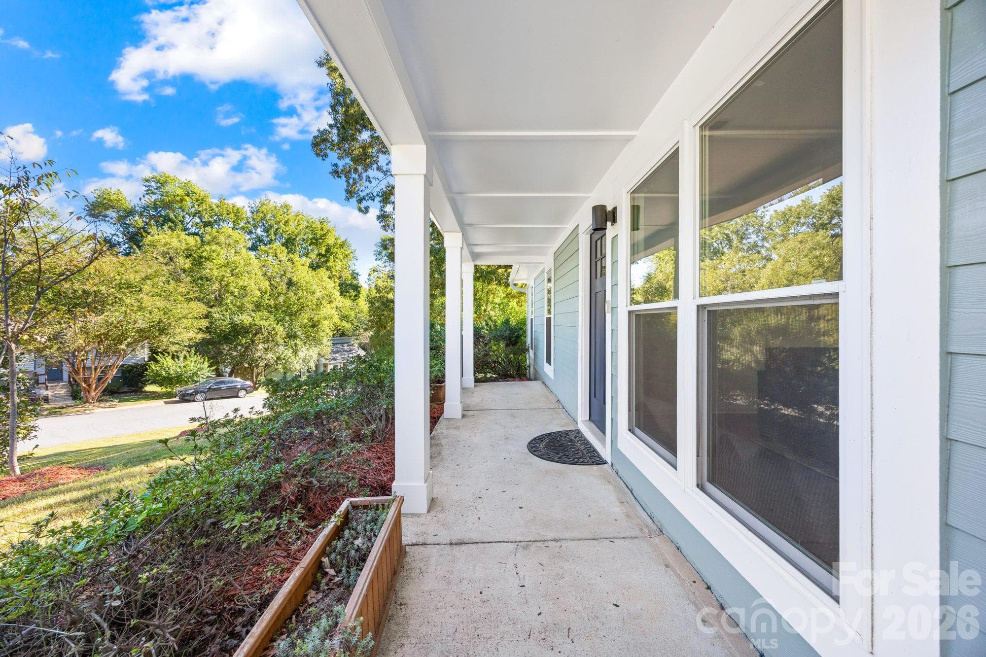 Covered front porch on a one-level ranch home in Charlotte, NC 28212 - 4900 Cricklewood Lane, Charlotte