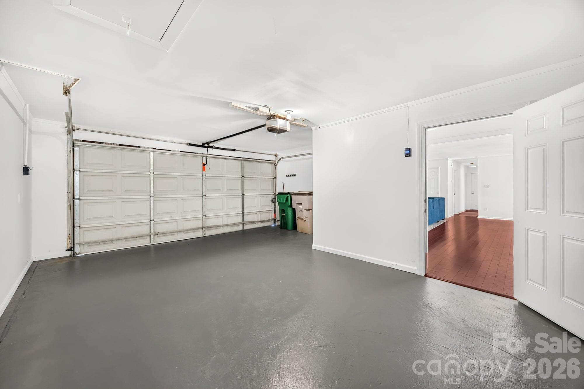 Attached garage that fits one car plus storage or workshop space, with direct entry to the home - 4900 Cricklewood Lane, Charlotte