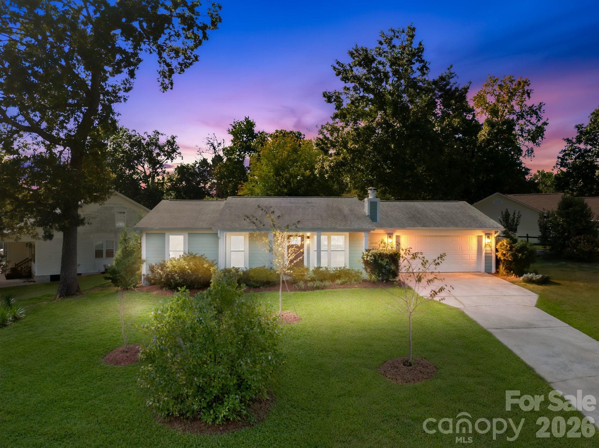 Twilight view of 4900 Cricklewood Ln, a single-story ranch in Vernedale Farms off Sharon Amity Road, East Charlotte - 4900 Cricklewood Lane, Charlotte