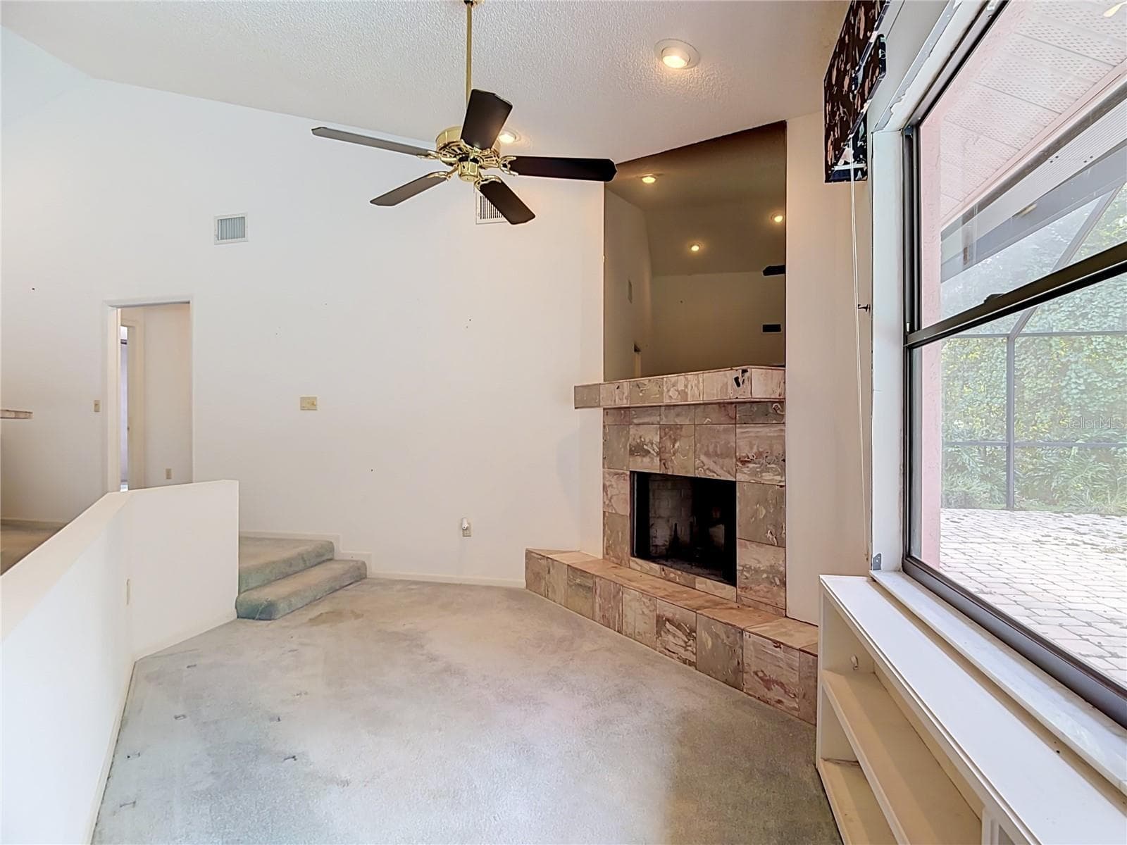 Sitting area has wood burning fireplace - 3305 IMPERIAL LN, LAKELAND