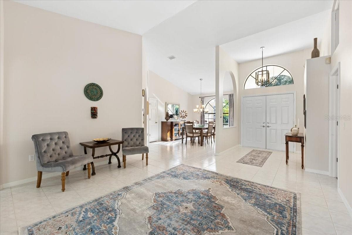 Living room, Dining Room and Foyer - 2656 SADDLEWOOD LN, PALM HARBOR