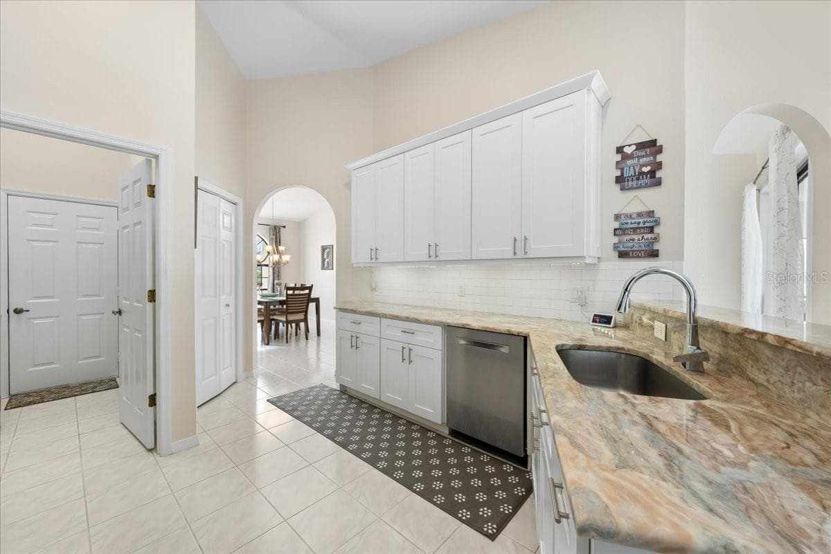 Kitchen looking out to Dining Room - 2656 SADDLEWOOD LN, PALM HARBOR