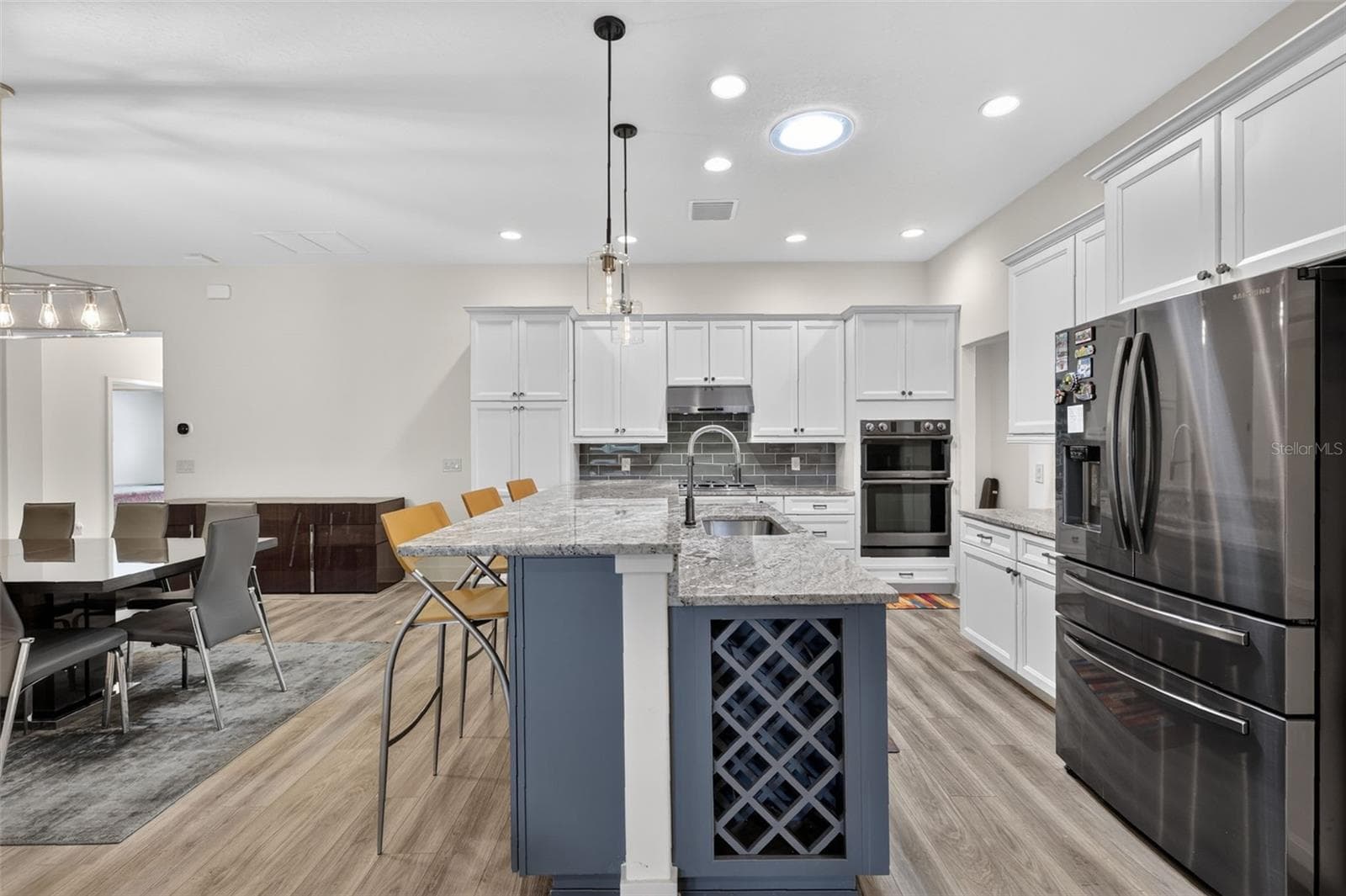 Kitchen with granite counters and stainless steel appliances - 2741 DUNHAM DR, THE VILLAGES
