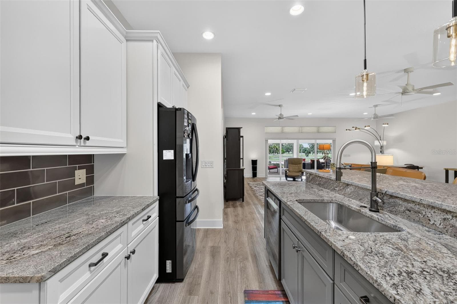 Kitchen with view of the pond - 2741 DUNHAM DR, THE VILLAGES
