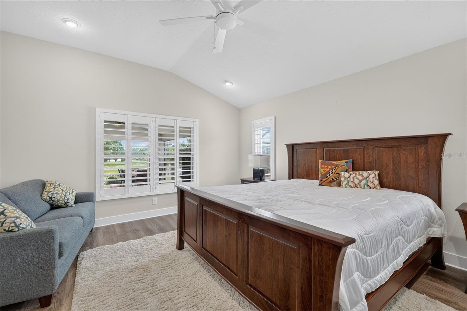 Primary bedroom - view of the pond and vaulted ceiling - 2741 DUNHAM DR, THE VILLAGES