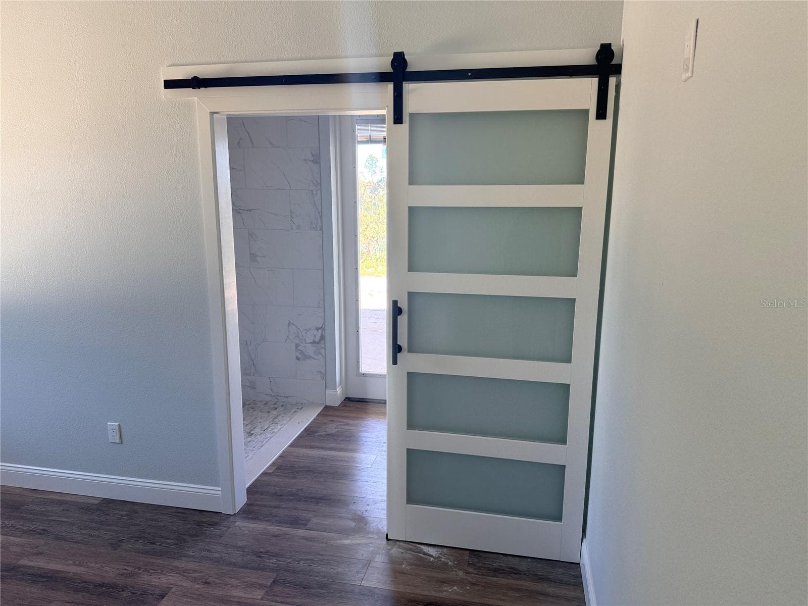 Barn Door to Rear Primary Bath - 2410 LAKE TINY RD, DELTONA