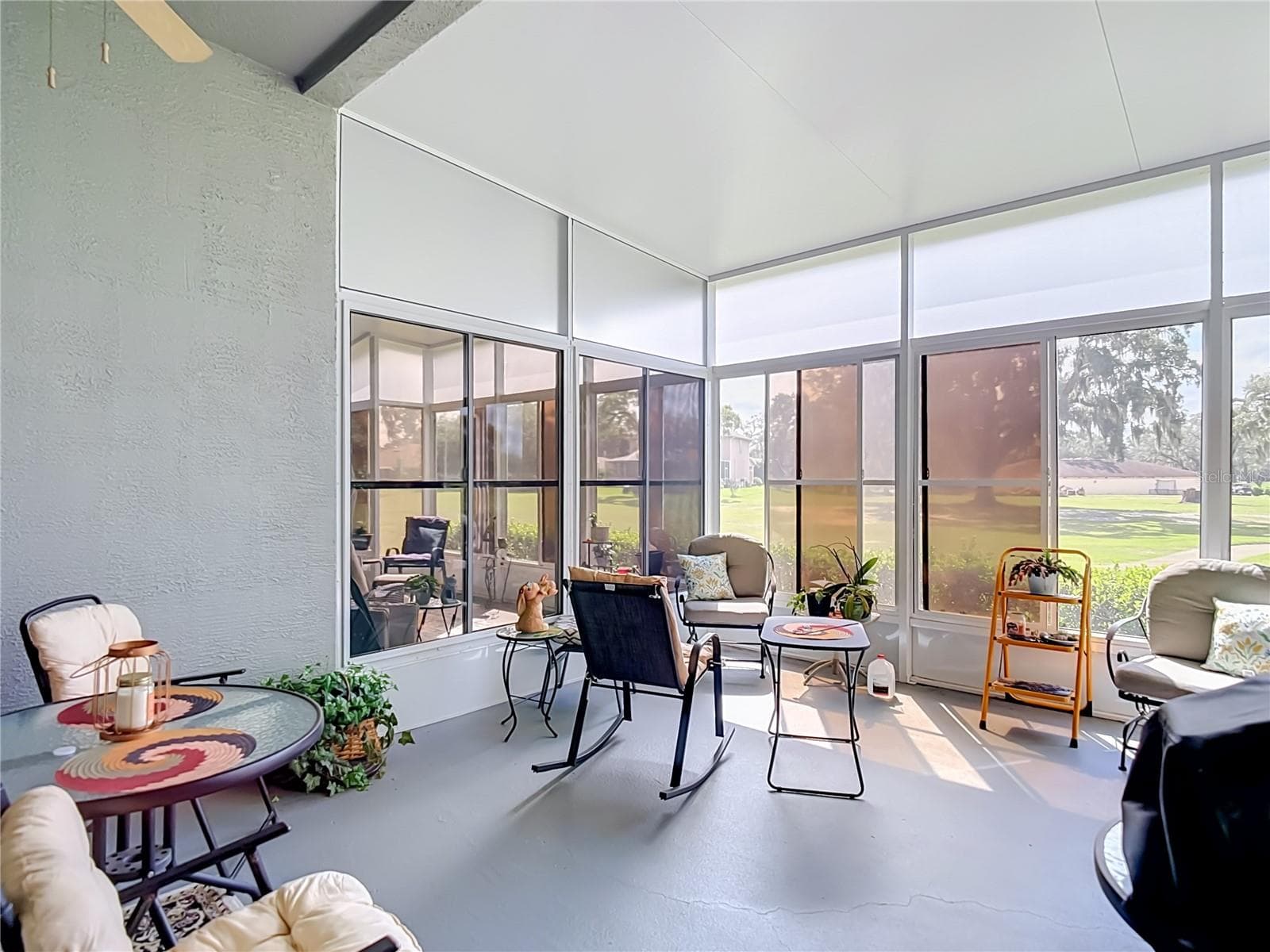Patio is screened and has vinyl sliding windows for cooler weather use. - 13424 NORMAN CIR, HUDSON