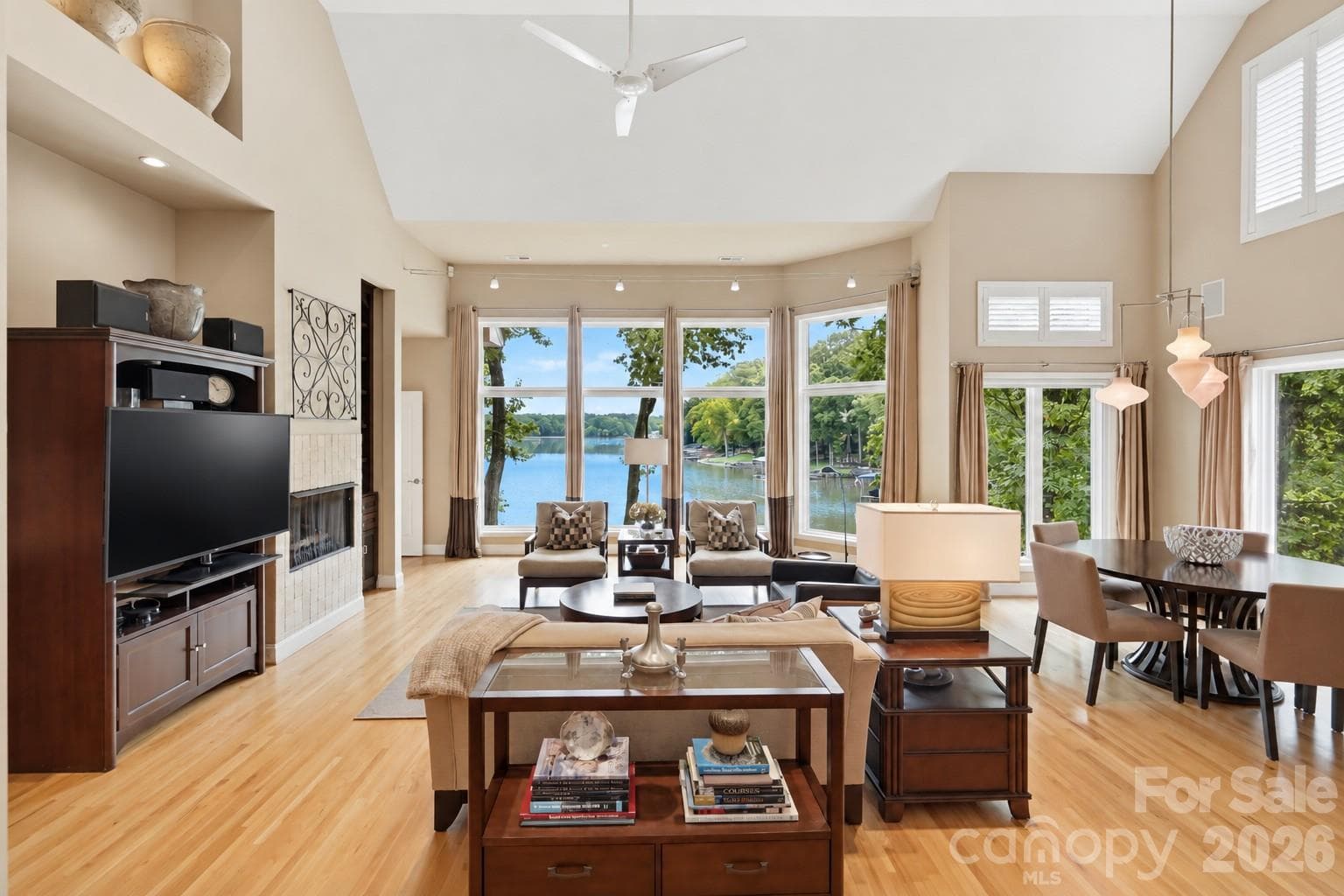 Vaulted ceiling, built-in cabinetry, cozy fireplace, and wet bar - 1075 Lakefront Woods Drive, Belmont