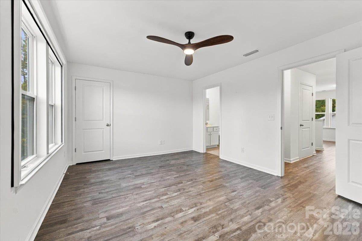 Upstairs bedroom has a huge walk-in closet with built-ins and ensuite bathroom - 24550 Blue Heron Circle, Lancaster